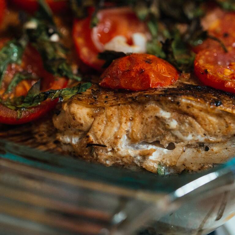 Baked fish with tomatoes and olives